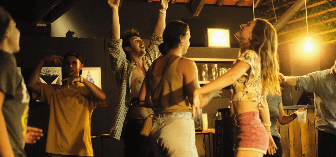 Guests celebrating at the hostel bar